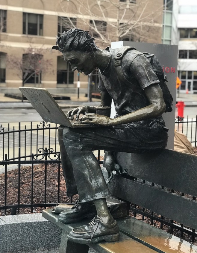 bronze laptop man