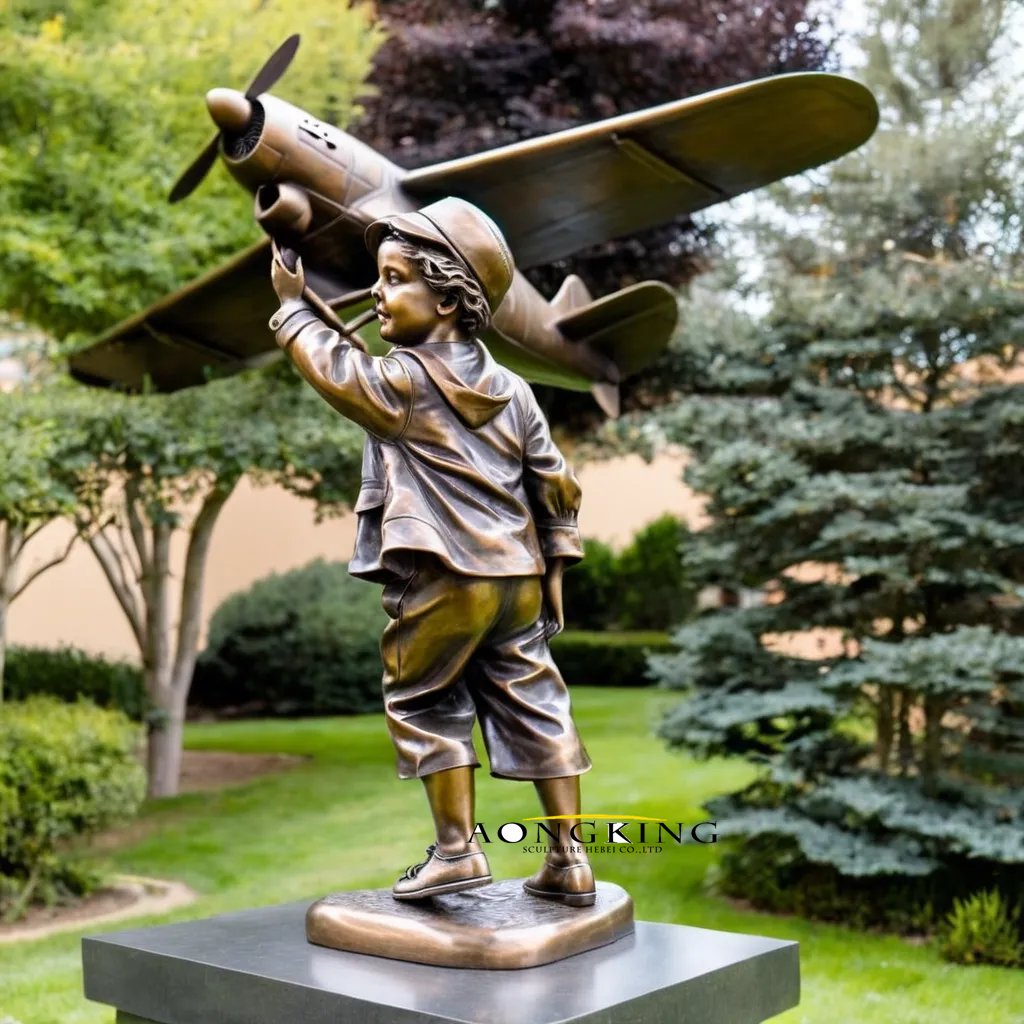 Kids playground airplane dream bronze curious statue of a boy